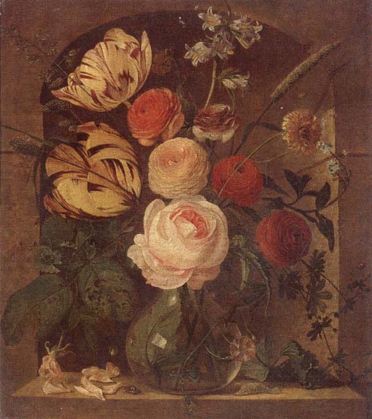Still life of various flowers in a glass vase,set in a niche